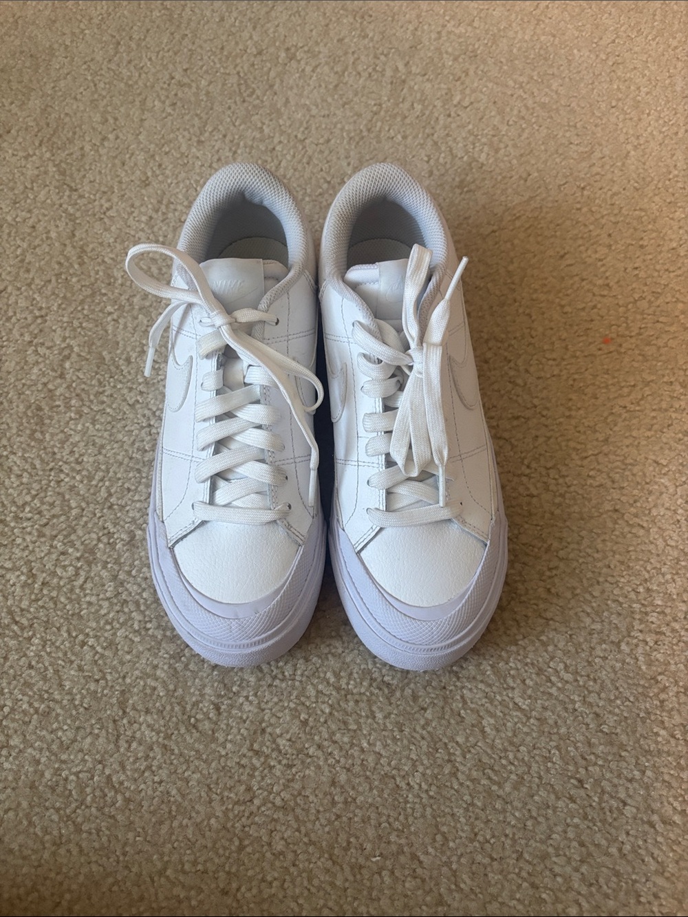 Nike Women’s White Low-Top Sneakers with Purple Sole and platform